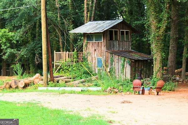9.69 Acres of Land with Home for Sale in Lithonia, Georgia