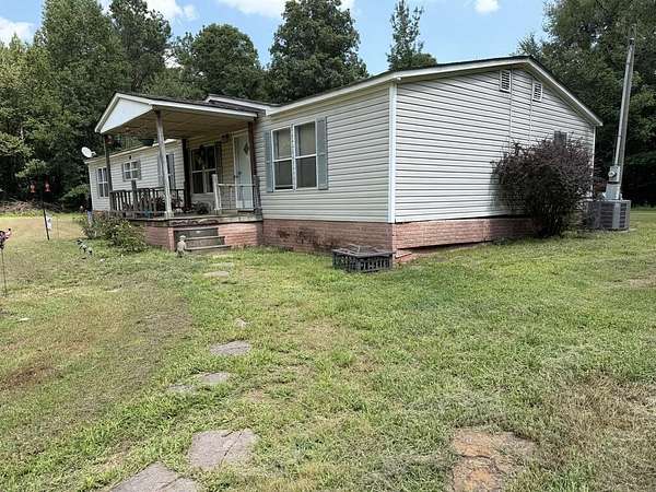 8 Acres of Land with Home for Sale in Hollow Rock, Tennessee