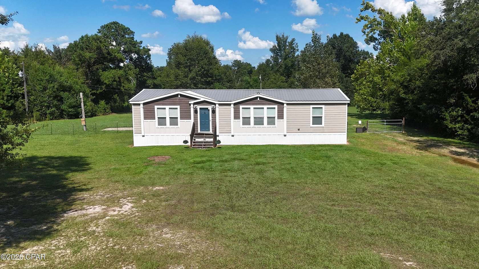 5.18 Acres of Land with Home for Sale in Sneads, Florida