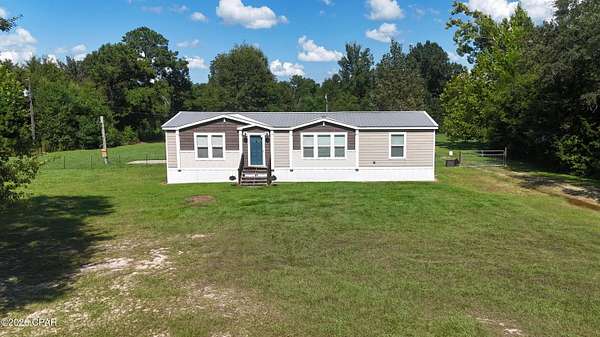 5.18 Acres of Land with Home for Sale in Sneads, Florida