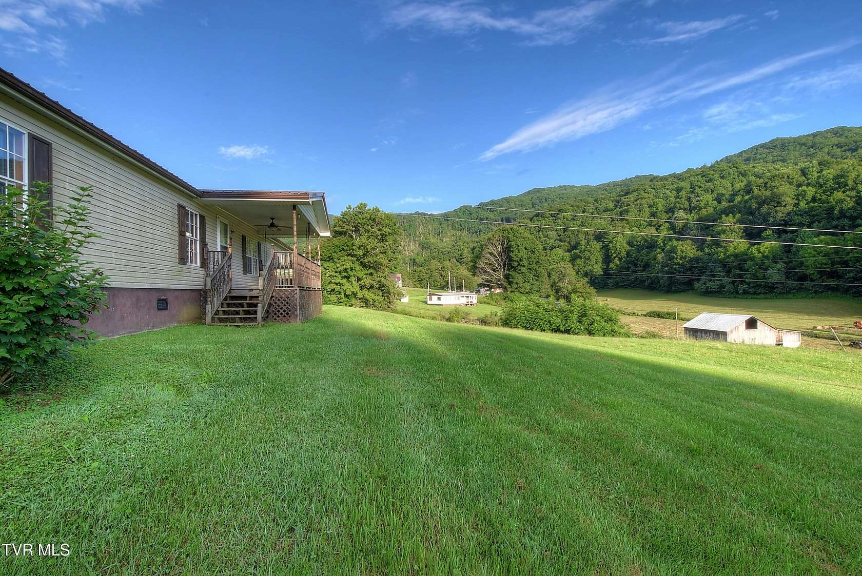 57.3 Acres of Land with Home for Sale in Flag Pond, Tennessee