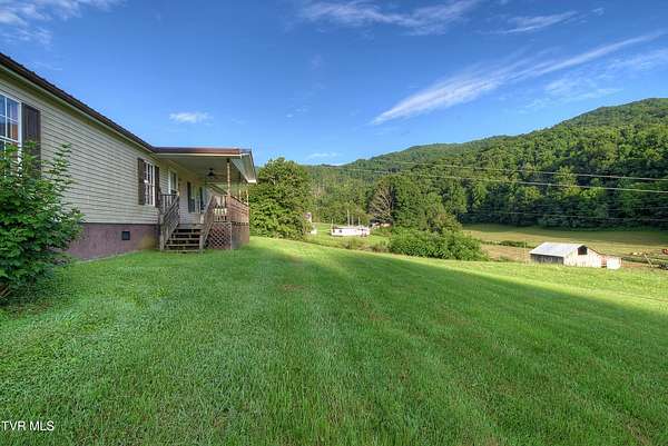 57.3 Acres of Land with Home for Sale in Flag Pond, Tennessee
