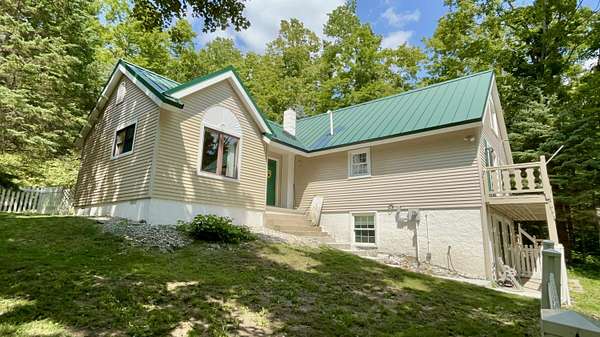 10 Acres of Land with Home for Sale in Vanderbilt, Michigan
