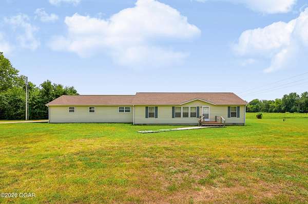 1.75 Acres of Land with Home for Sale in Carthage, Missouri