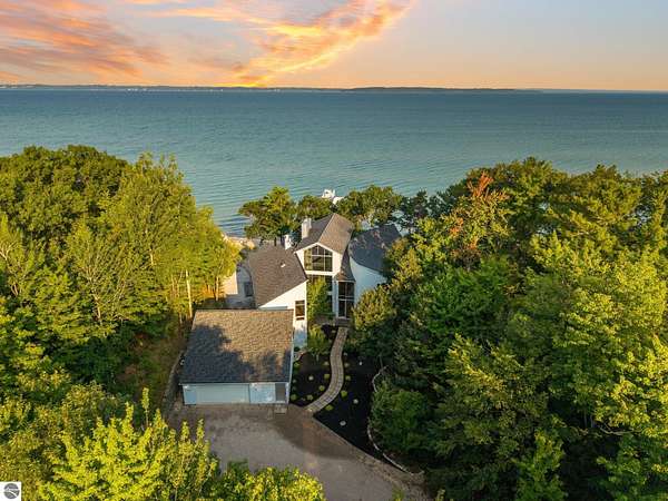 6.46 Acres of Land with Home for Sale in Kewadin, Michigan