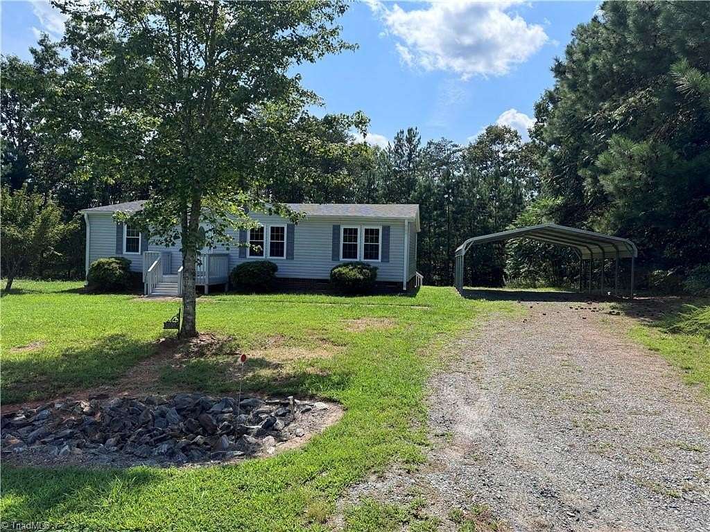 1.55 Acres of Land with Home for Sale in East Bend, North Carolina