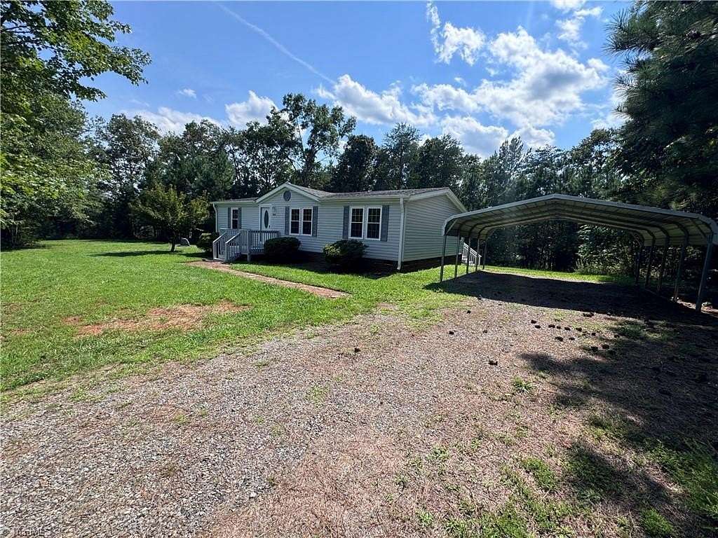 1.55 Acres of Land with Home for Sale in East Bend, North Carolina