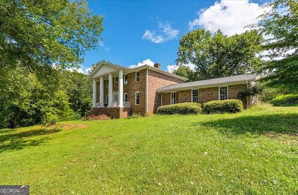 12 Acres of Land with Home for Sale in Bowdon, Georgia