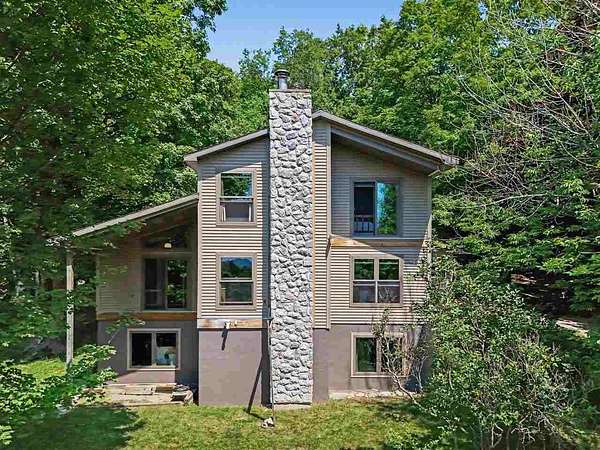 11 Acres of Recreational Land with Home for Sale in Central Lake, Michigan