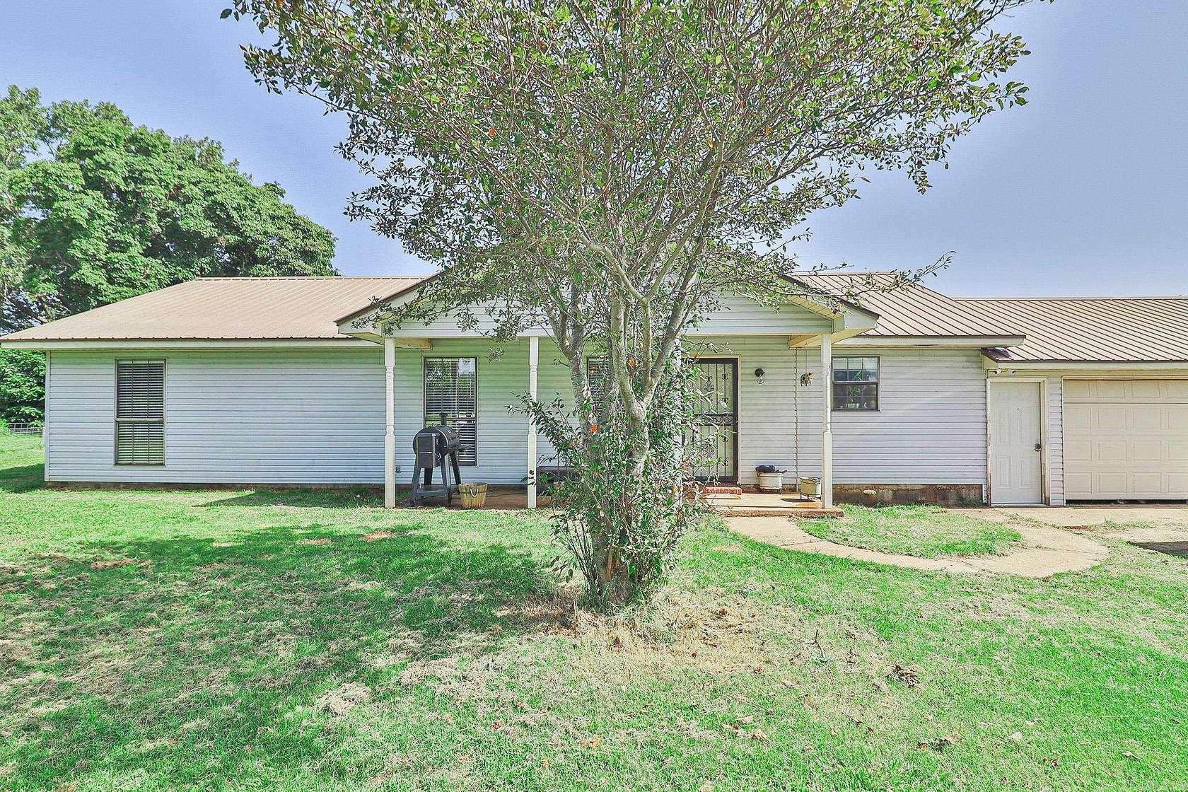4.26 Acres of Land with Home for Sale in Hickory Ridge, Arkansas