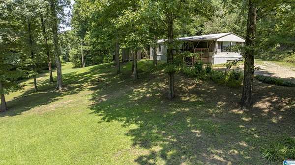 8.6 Acres of Land with Home for Sale in Locust Fork, Alabama