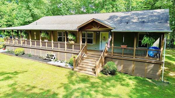 10.5 Acres of Land with Home for Sale in Big Sandy, Tennessee