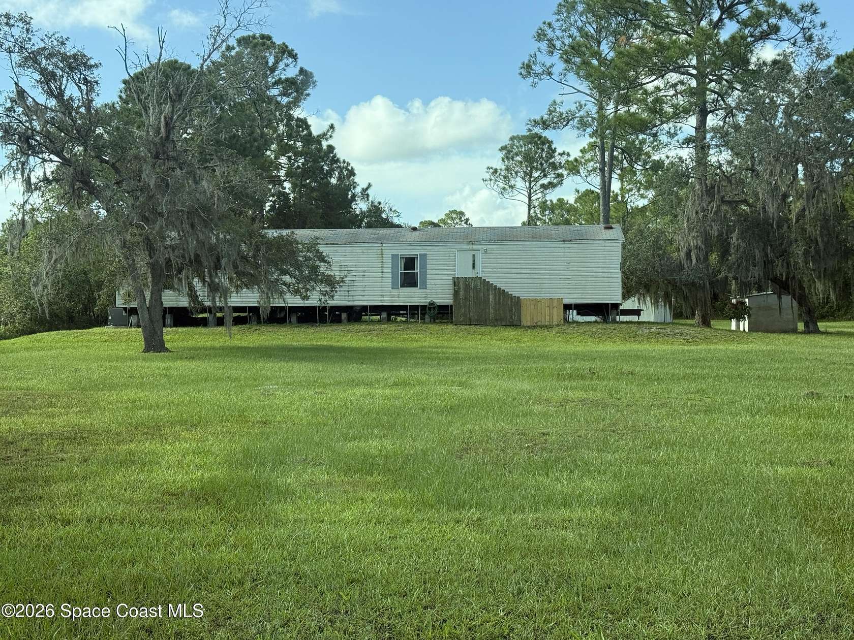 3.68 Acres of Land with Home for Sale in Mims, Florida