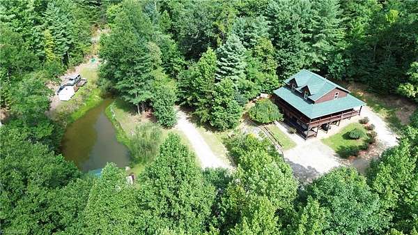 4.16 Acres of Land with Home for Sale in Purlear, North Carolina