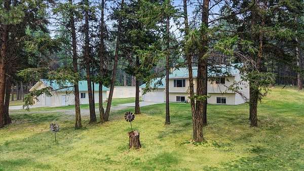10.1 Acres of Recreational Land with Home for Sale in Kila, Montana