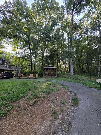 3.8 Acres of Land with Home for Sale in Cunningham, Tennessee