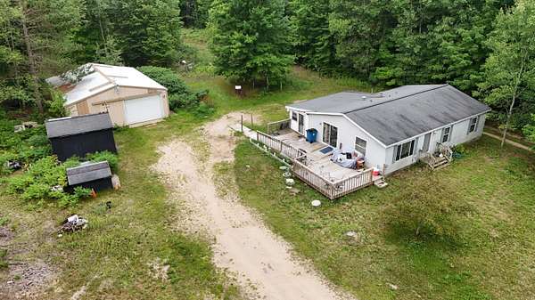 5 Acres of Land with Home for Sale in Thompsonville, Michigan