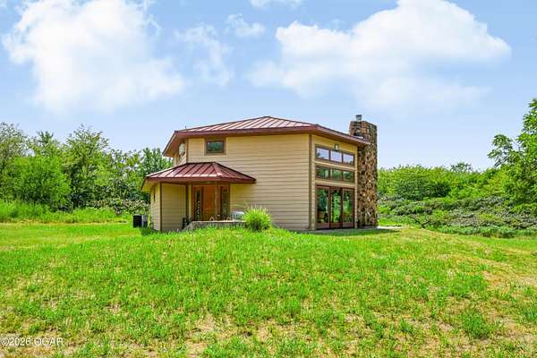 150 Acres of Recreational Land with Home for Sale in Carthage, Missouri