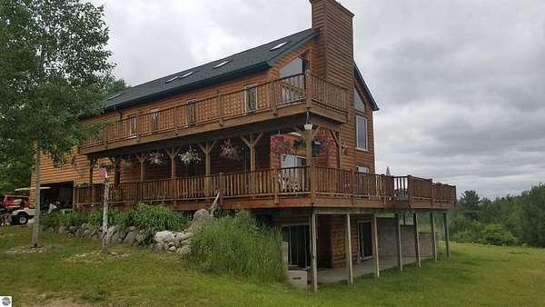 37.2 Acres of Recreational Land with Home for Sale in Comins, Michigan