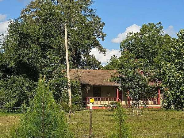 7.43 Acres of Land with Home for Auction in McDavid, Florida