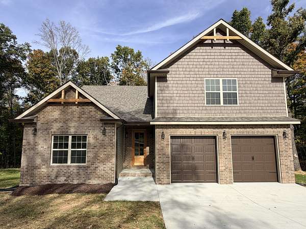 1.5 Acres of Land with Home for Sale in Cunningham, Tennessee