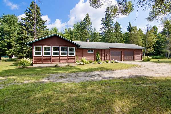 5 Acres of Land with Home for Sale in Boyne Falls, Michigan