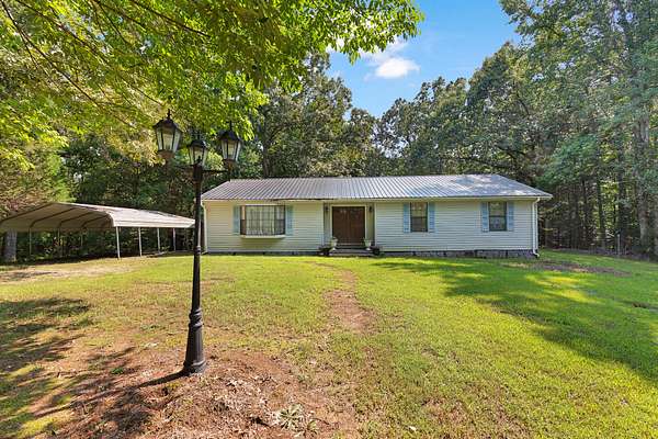 48 Acres of Land with Home for Sale in Buena Vista, Tennessee