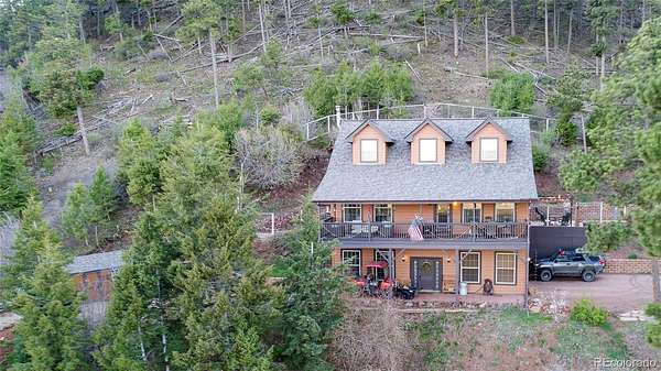 5.85 Acres of Land with Home for Sale in Larkspur, Colorado