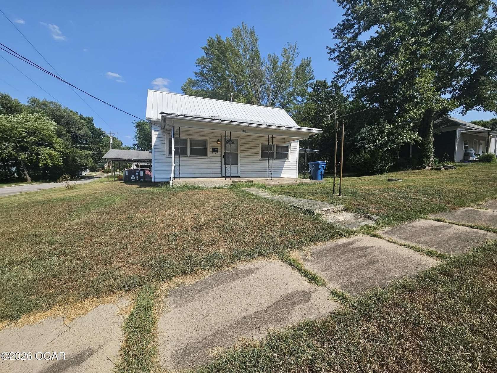 0.32 Acres of Land with Home for Sale in Carterville, Missouri