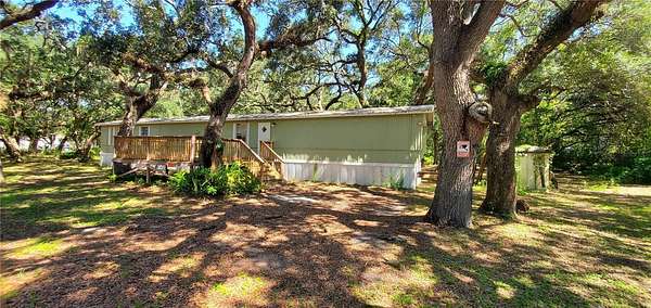 1.69 Acres of Land with Home for Sale in Hudson, Florida