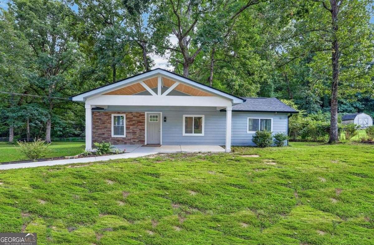 6.7 Acres of Land with Home for Sale in Riverdale, Georgia