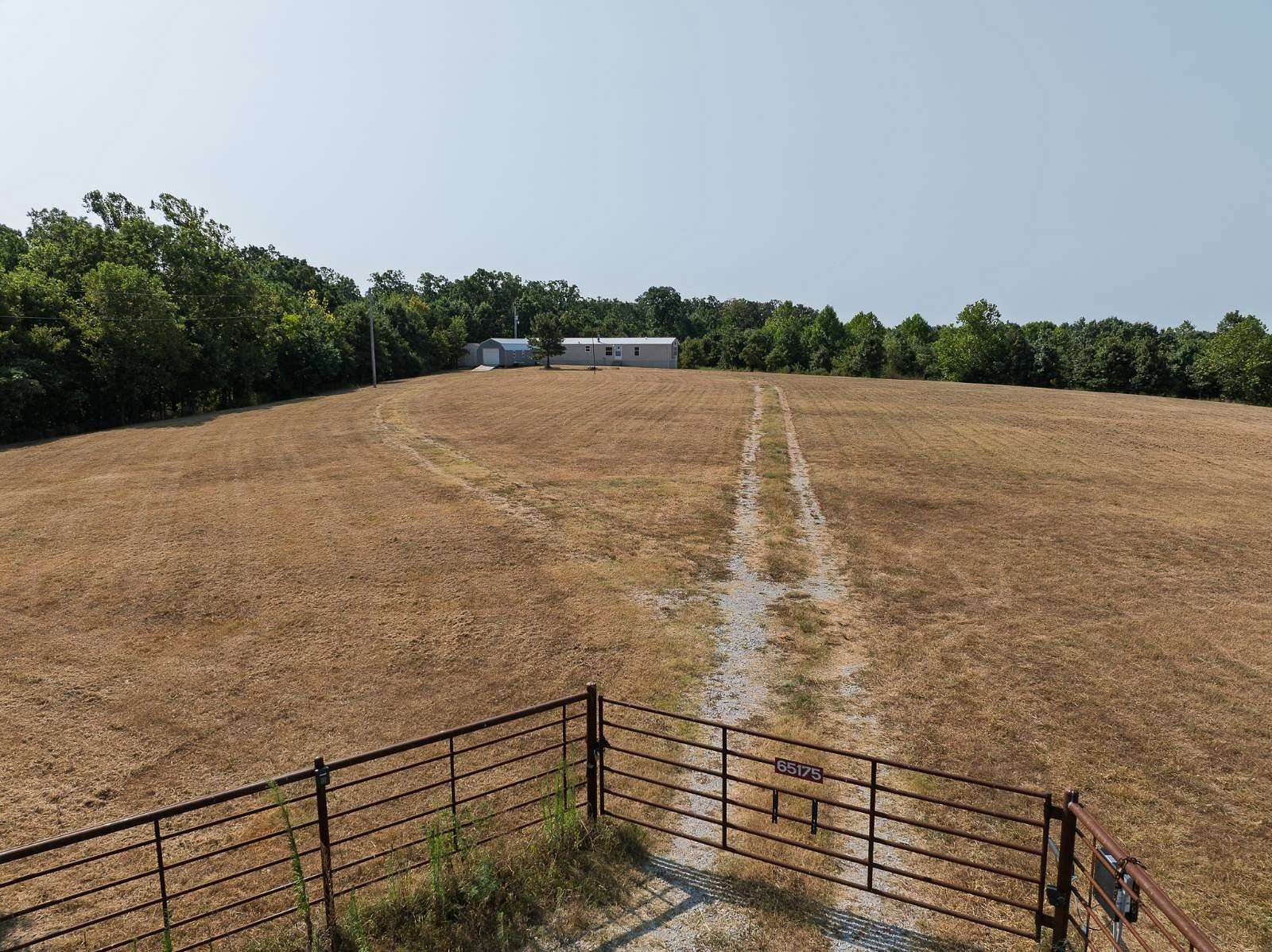 29.9 Acres of Land with Home for Sale in Wyandotte, Oklahoma