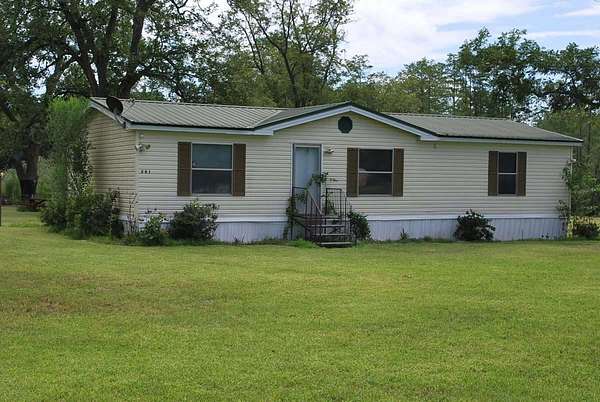 7.3 Acres of Land with Home for Sale in Ty Ty, Georgia