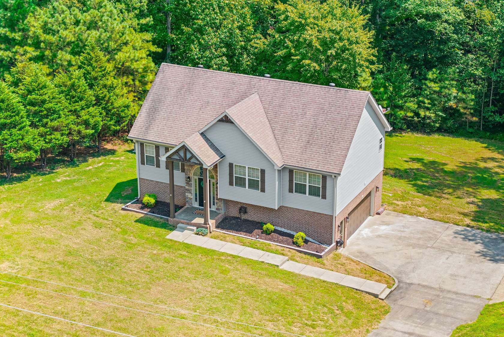 1.5 Acres of Land with Home for Sale in Cunningham, Tennessee