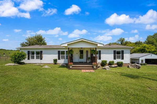 5 Acres of Land with Home for Sale in Adams, Tennessee