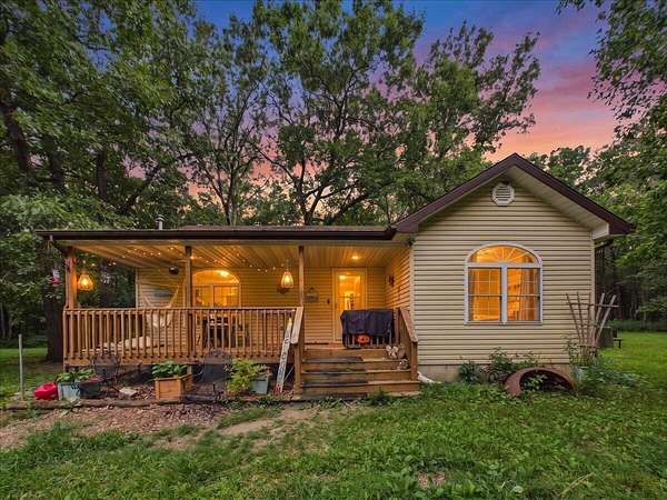 11.1 Acres of Land with Home for Sale in Wheatland, Missouri