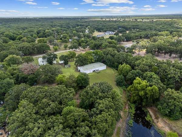 4.76 Acres of Land with Home for Sale in Scurry, Texas