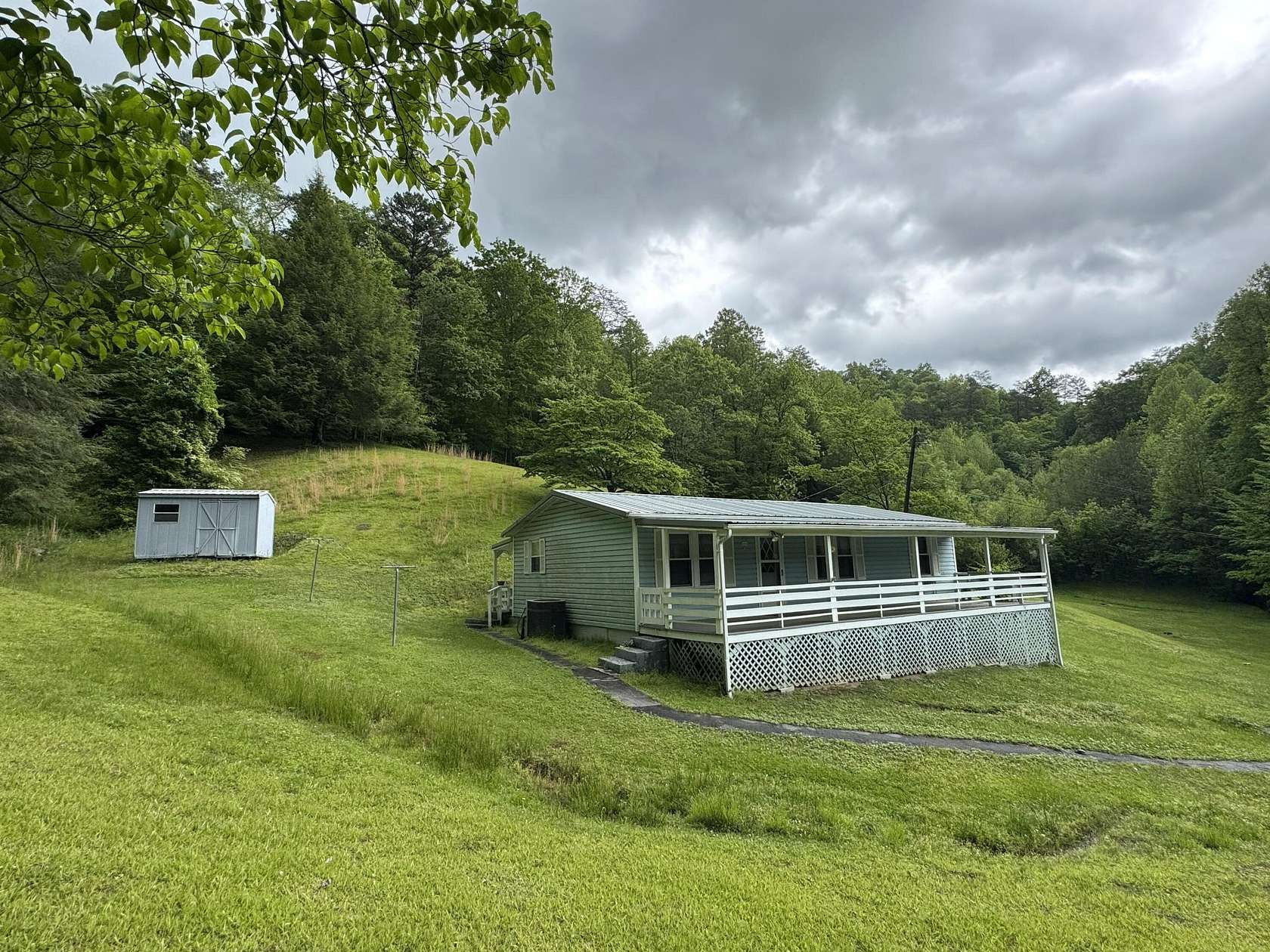10 Acres of Land with Home for Sale in Calvin, Kentucky