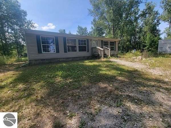 5 Acres of Land with Home for Sale in Turner, Michigan