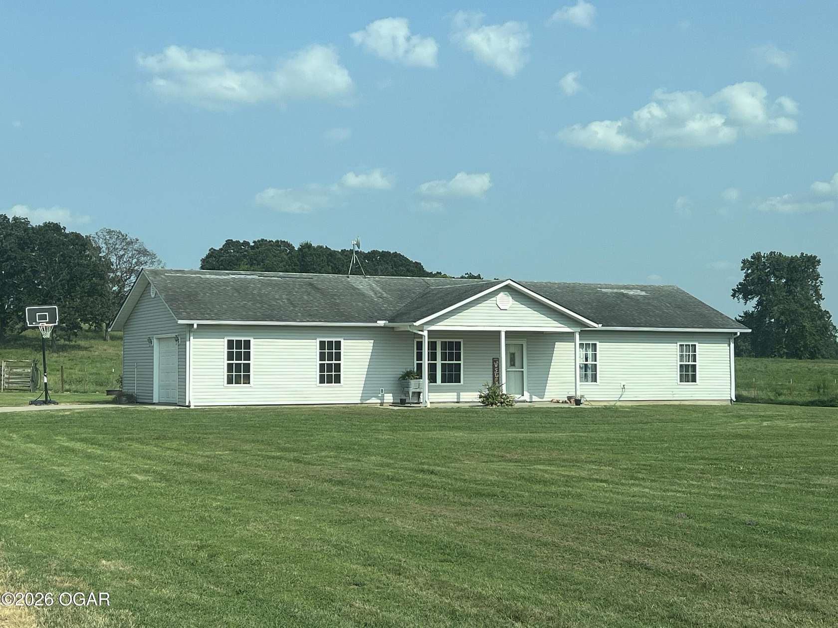 20.4 Acres of Agricultural Land with Home for Sale in Lockwood, Missouri