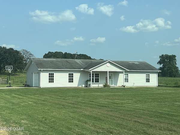 20.4 Acres of Agricultural Land with Home for Sale in Lockwood, Missouri