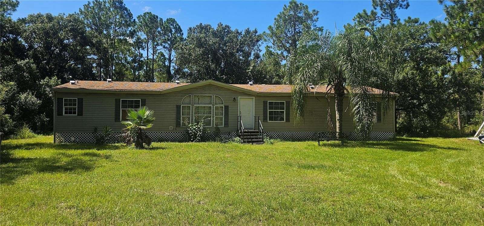 6.78 Acres of Land with Home for Sale in Myakka City, Florida
