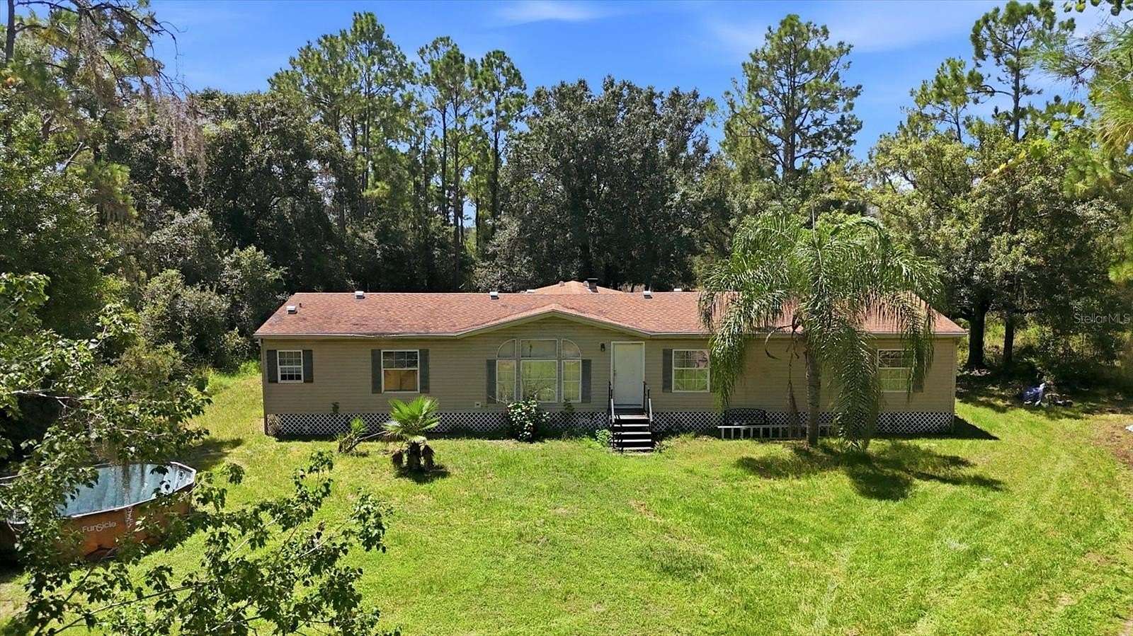 6.78 Acres of Land with Home for Sale in Myakka City, Florida
