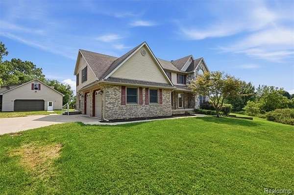 5 Acres of Land with Home for Sale in Oceola Township, Michigan