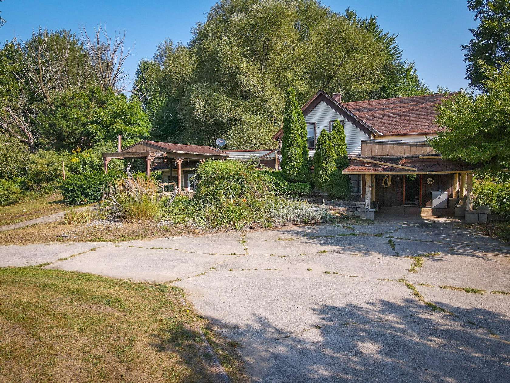 9.73 Acres of Land with Home for Sale in Twin Lake, Michigan