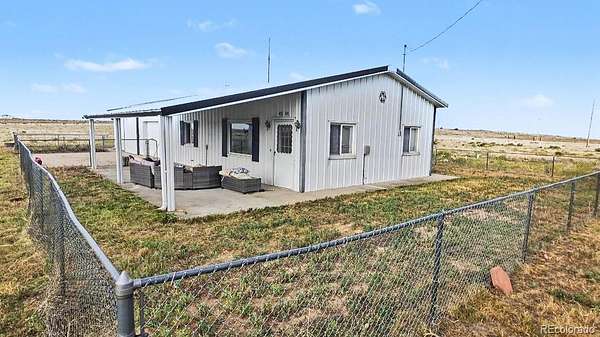 158 Acres of Agricultural Land with Home for Sale in Fort Morgan, Colorado