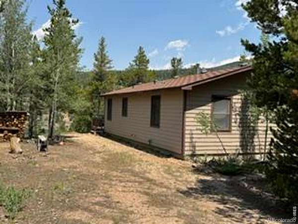 1.69 Acres of Land with Home for Sale in Red Feather Lakes, Colorado
