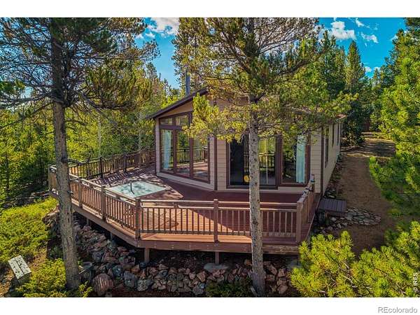 1.69 Acres of Land with Home for Sale in Red Feather Lakes, Colorado