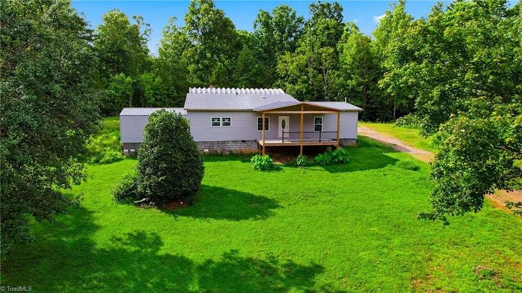 7 Acres of Land with Home for Sale in Boomer, North Carolina