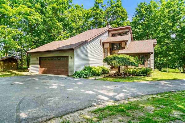 40 Acres of Land with Home for Sale in Charlevoix, Michigan
